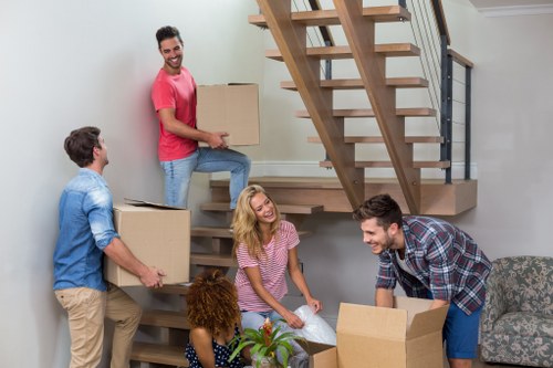 Moving van and packed boxes outside a Hoxton apartment building