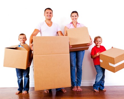 Professional movers preparing boxes and furniture for transport in Hoxton