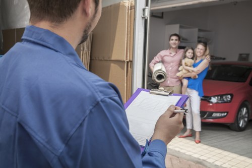 Loading furniture into a van in a Hoxton street with limited parking
