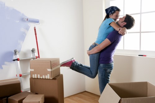 Furniture being carried from a Hoxton apartment during a local move