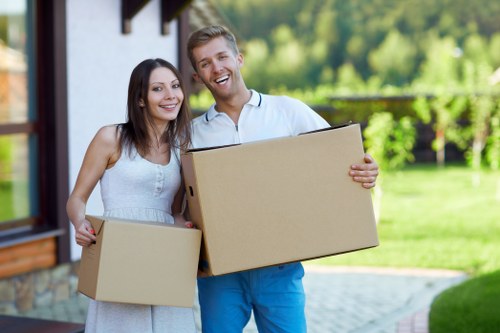 Hoxton moving service handling boxes and furniture near apartments