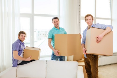 Hoxton moving service handling furniture in a residential street