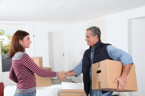 Unpacking boxes in a Hoxton flat after moving day
