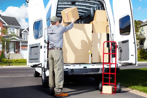 Team loading boxes and furniture into a removals van for a Hoxton move