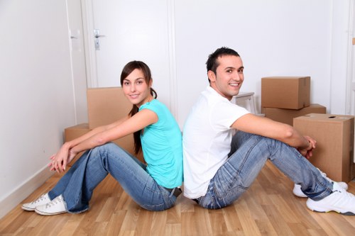 Removal van and movers handling furniture for a local property move